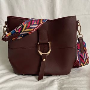 Two piece burgundy leather handbag